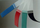 Colored flexible plastic welded coupons